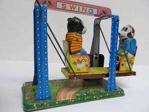 lot 202 image: Vintage 1950s era Japan Tin Litho Wind-Up Swinging Bear Toy