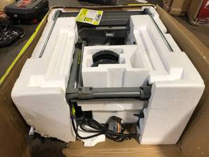 lot 40 image: RYOBI 15 Amp 10 in. Expanded Capacity Portable Corded Table Saw With Rolling Stand   Customer Returns See Pictures