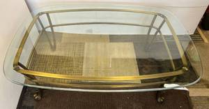 lot 27 image: Glass Top Heavy Brass Coffee Table 48L x 34W x 17T With 12 Glass