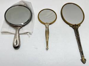 lot 45 image: Three Antique Dresser Hand Mirrors