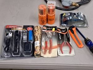 lot 170 image: Hand Tools (in original packaging) - (2) Flashlights, (1) Groove Joint Pliers, (1) Needlenose Pliers, (1) Box Cutter, (1) Screwdriver, (1) NASCAR Protective Eyewear, (2) Dial-A-Bit Drill Bit Sets