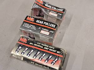 lot 171 image: MIT Hand Tools - (2) 3 3-Jaw Gear Pullers, (1) 38 Drive Square Drive 8pc Universal Joint Socket Set