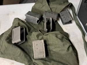 lot 33 image: Gun Accessories - (6) Old Ammo Clips, (1) Ammo Pouch