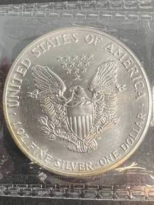 lot 57 image: 1989 AMERICAN SILVER EAGLE 1 TROY OZ .999 FINE SILVER