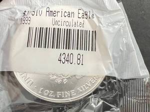 lot 64 image: 1999 AMERICAN SILVER EAGLE 1 TROY OZ .999 FINE SILVER UNC