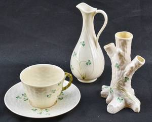 lot 135 image: Belleek Ireland Porcelain Shamrock Cup and Saucer, Typha Spill Vase, and Tree Vase