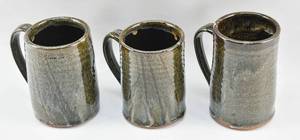 lot 187 image: 3 Large Hand Thrown Dark Green Ceramic Mugs by Mary Catherine Swartout