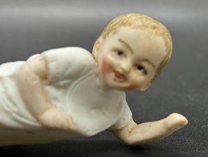 Vintage Porcelain Piano Baby Figurine