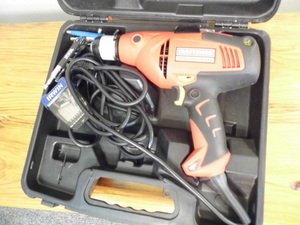 lot 303 image: Craftsman electric drill with some accessories and a case