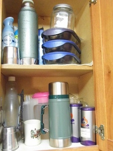 lot 341 image: Cabinet full of thermoses, silver plated platter and more