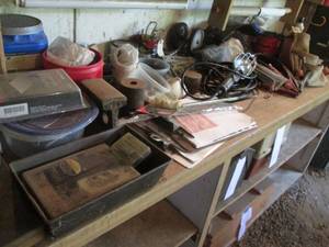 lot 64 image: All content on top of workbench including hardware, treble light, jumper cables, whetstones, organizers and so much more