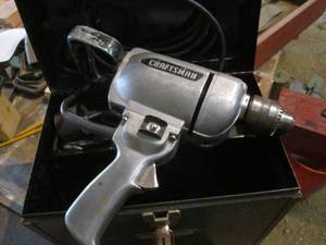 lot 52 image: Vintage Sears Craftsman 12 industrial drill in metal case with an assortment of bits and other supplies