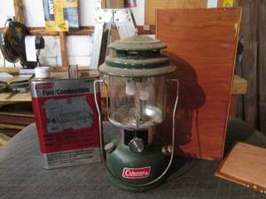 lot 82 image: 1974 Coleman lantern with combustible fuel and hand made protective box