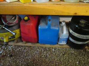 lot 99 image: Gas and kerosene cans, oil drain pans and more