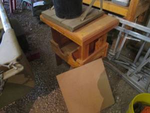 lot 458 image: Small Solid Wood workbench, bucket of casters and more.  Bench measures approximately 241928