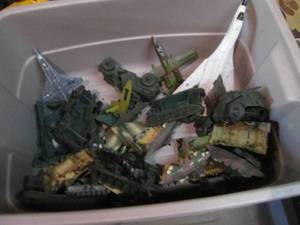 lot 485 image: Covered tote with an assortment of die cast planes and plastic army vehicles