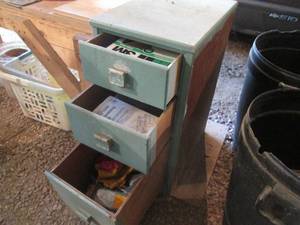 lot 58 image: Vintage wooden 3-drawer cabinet with an assortment of sanding paper, craftsman dwelling jig, screwdriver bit index, flaring tool and so much more