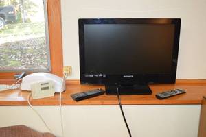 lot 259 image: Magnavox LED Monitor  Landline Telephone, Remotes, and Humidity Monitor