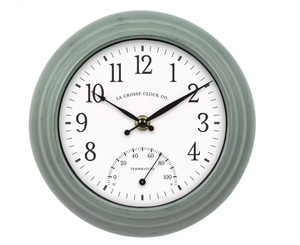 lot 73 image: La Crosse Clock 8 in. Sage Green IndoorOutdoor Quartz Analog Wall Clock