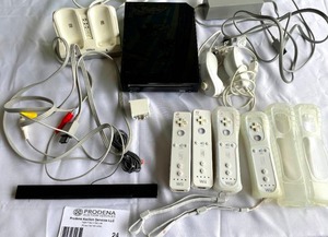 lot 24 image: Nintendo Wii Lot- Includes Console, Controllers, Num-chuks and More