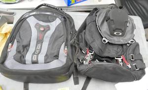 lot 115 image: Another Swiss gear bag and a bag with some serious hardware on it