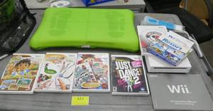 lot 121 image: Wii gaming system with balance board, player, controller and 6 games