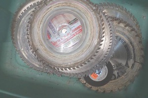 Used Variety of Saw blades in green tote