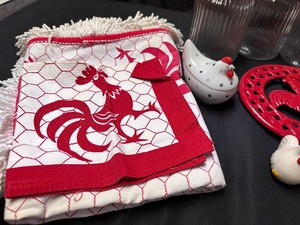 lot 497 image: Set of 4 Rooster and Hen Glass Canister Set, Salt and Pepper Shaker, Tablecloth, Napkins, Apron, and Hot Plate