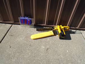 lot 107 image: McCullough EM250 110 volt chainsaw. Nice used condition. Tested & works. As shown.