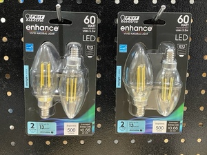 lot 60 image: Feit Electric 60 Watt Daylight LED Blunt Tip Decorative Bulbs