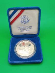 lot 3 image: 1986 Ellis Island United States One Dollar Liberty Silver Coin