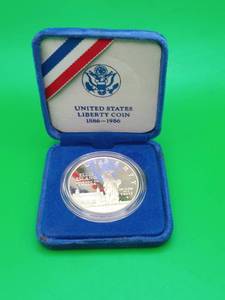 lot 4 image: 1986 Ellis Island United States One Dollar Liberty Silver Coin