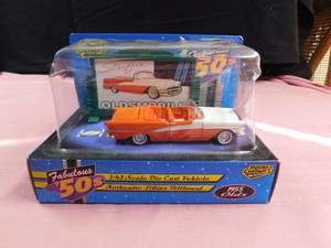 lot 23 image: 1997 Fabulous 50s 1955 Olds die cast with Authentic fifties billboard