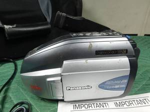 lot 81 image: Vintage Panasonic Movie camera in case and accessories