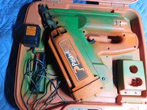 lot 116 image: Paslode nailer with battery and charger in case