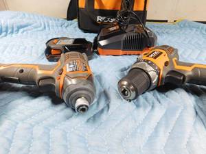 lot 132 image: Ridgid Multi-tool, drill, 2 batteries and charger in case