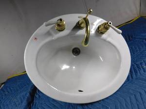 lot 169 image: Kohler Porcelain bathroom sink with faucet and drain
