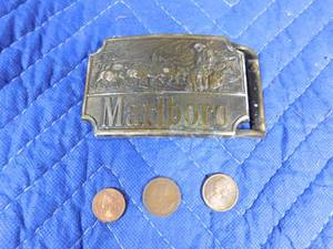 lot 335 image: Marlboro belt buckle and 3 Canadian coins