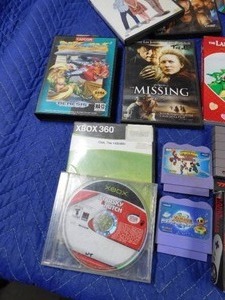 lot 349 image: Saga Genesis, X-box, Super Nintendo, Play station, and Vtech games and DVDs and game controller