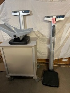lot 34 image: WOW Lot Of 2 Matching Style Scales - Health O Meter Professional 500KL Adult Patient Floor Scale and 534KL Pediatric Infant Weighing Scale - Both Good Working Condition - Both Will Need New Batteries Cart Not Included