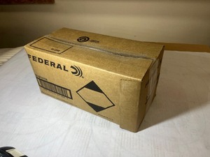 lot 712 image: 1 box of Federal American Eagle Rifle Cartridges, 223 Rem Full Metal Jacket Boat-Tail. 223 REM, 55 GR Box of 1000