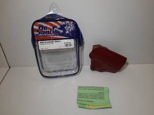 lot 1143 image: DeSantis Gunhide Mini Scabbard (right), Springfield Hellcat Pro