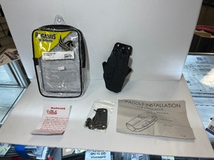 lot 976 image: Pegasus by Desantis Holsters  CAZZUTO (right) for Springfield