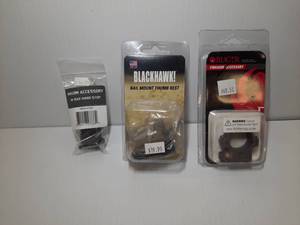 lot 1154 image: (3)&nbspFirearm Accessories Maxim M-RAX Hand Stop,  Blackhawk Thumb Rest, Ruger Scope Ring Assy