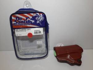 lot 1245 image: DeSantis Gunhide Mini Scabbard (left), Springfield Hellcat Pro