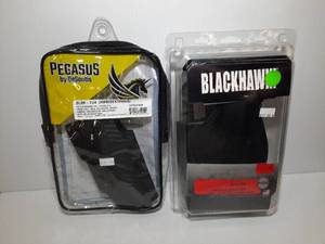 lot 1356 image: (2) Firearm accessories  Pegasus by DeSantis Slim Tuk Holster Blackhawk Nylon Paddle Holster