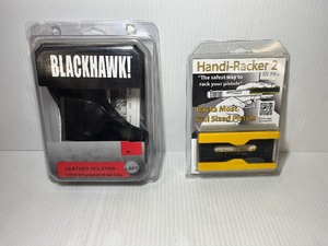 lot 1402 image: (2) Firearm Accessories Blackhawk Leather Holster, Check Six Springfield XD Sub Comp, Left, # 08 Handi-Racker 2