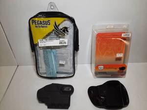 lot 1393 image: (2) Firearm holsters Pegasus Slim Tuk Ambidextrous Holster, Ruger Max - 9 Bulldog Leather Molded Holster