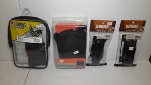 lot 1418 image: (4) Firearm Accessories Pegasus Quantico Double Mag Pouch Bulldog BDT Magazine Pouch (2) Blackhawk Mag Pouches