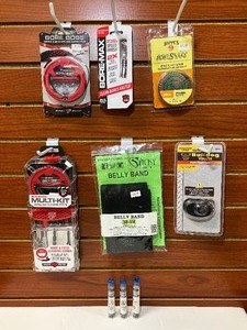 lot 1364 image: (9) Firearm Accessories Sticky Holsters Belly Band Real Avid tools Bulldog Keyed Trigger Lock Hoppes Snake Pistol Cleaner
